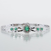 ARMBAND 18k vitguld, med smaragder och diamanter