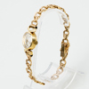 DAMARMBANDSUR, 18k guld, Onsa, tot vikt ca 25,6 g 