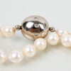 PÄRLCOLLIER, odlade pärlor, lås av 18k vitguld med vita stenar, 1998