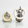 SKALLROR, 2 st, silver, 1900-tal, tot vikt inkl plast ring ca 30 g