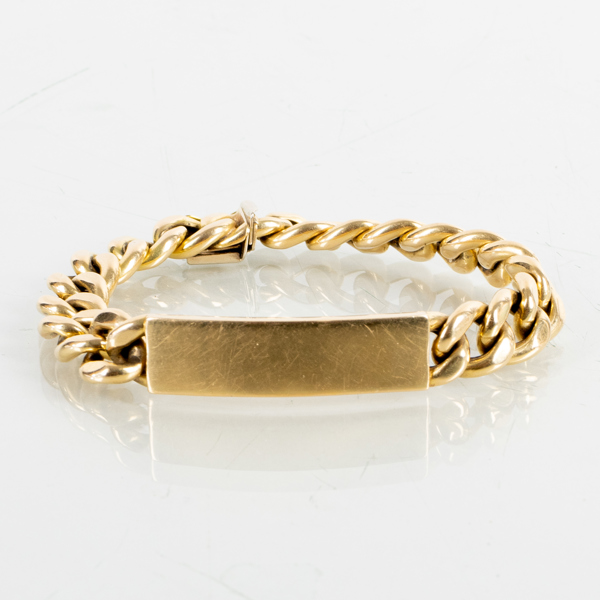 ARMBAND, 18k guld, med plakett, vikt ca 36,4 g