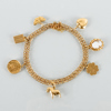 ARMBAND, 18k guld, Stockholm 1947, med berlocker, tot vikt ca 15,3 g