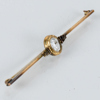 BROSCHNÅL, förgyllt silver med vit sten, 1900-talets första hälft