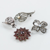 BROSCHER, 4 st, silver och bla granater, 1900-tal