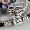 ARMBAND, 2 st, Pandora, sterlingsilver, med berlocker, 2000-tal